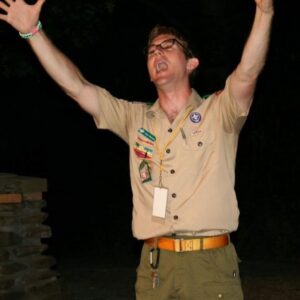 scout leader with raised arms