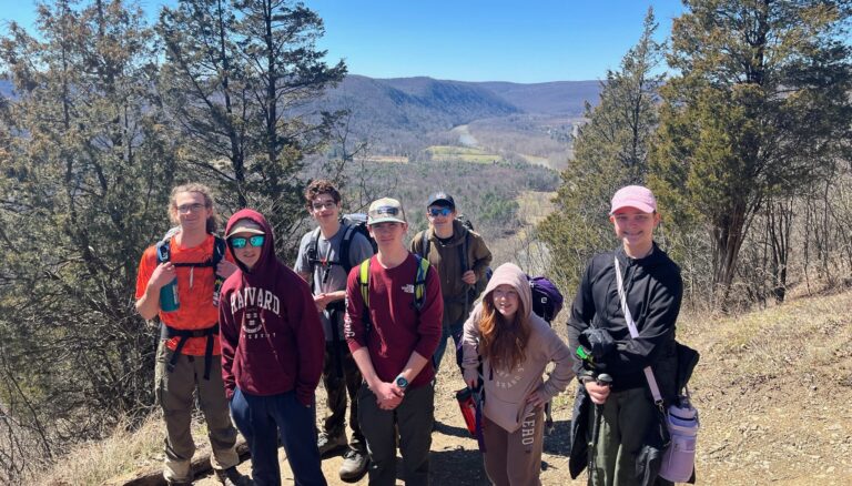 Troop 87 members backpacking along trail in Tanglewood Nature Preserve