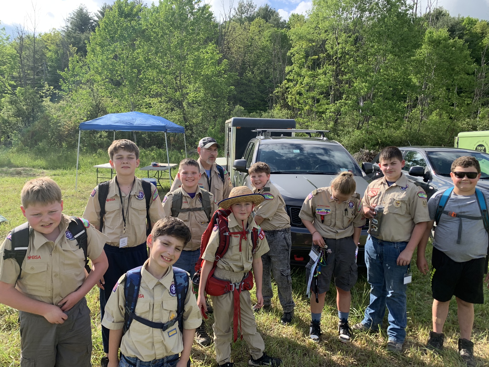 Nine youth members of Troop 87 and one of their adult leaders prepare to leave the campsite for a day of outdoor fun!